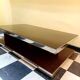 Designer coffee table in glass and chrome metal.