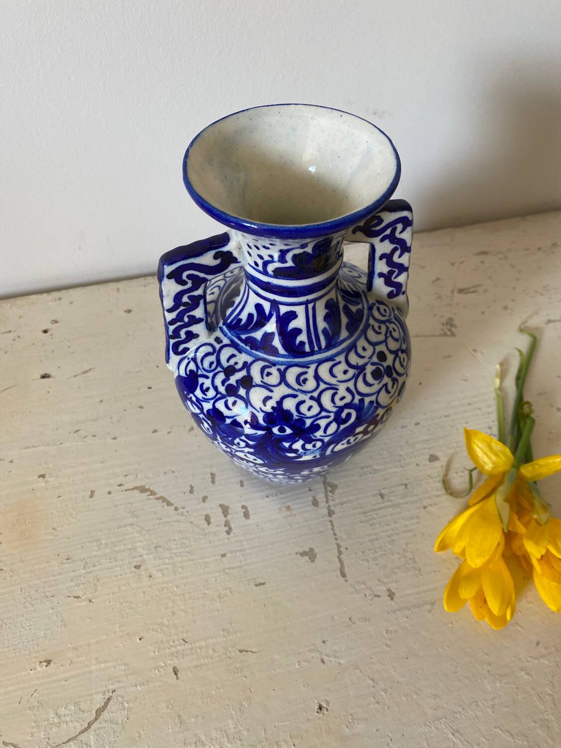 Small amphora vase in old hand-painted ceramic