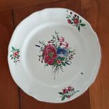 Ancien plat rond en faïence de l’est, motif floral