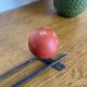 Coat rack with 3 red wooden balls