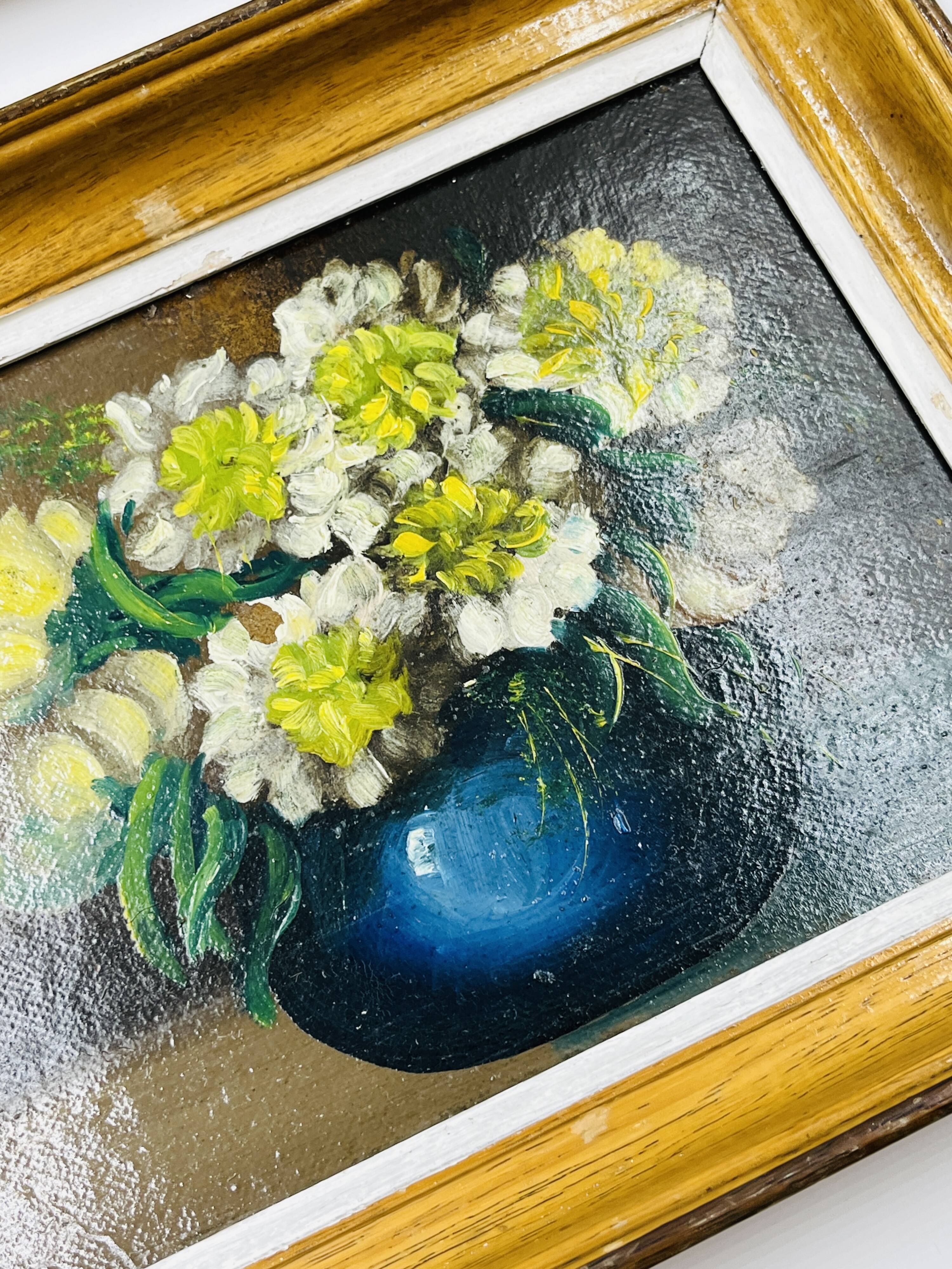 Pair of small framed vintage floral oils