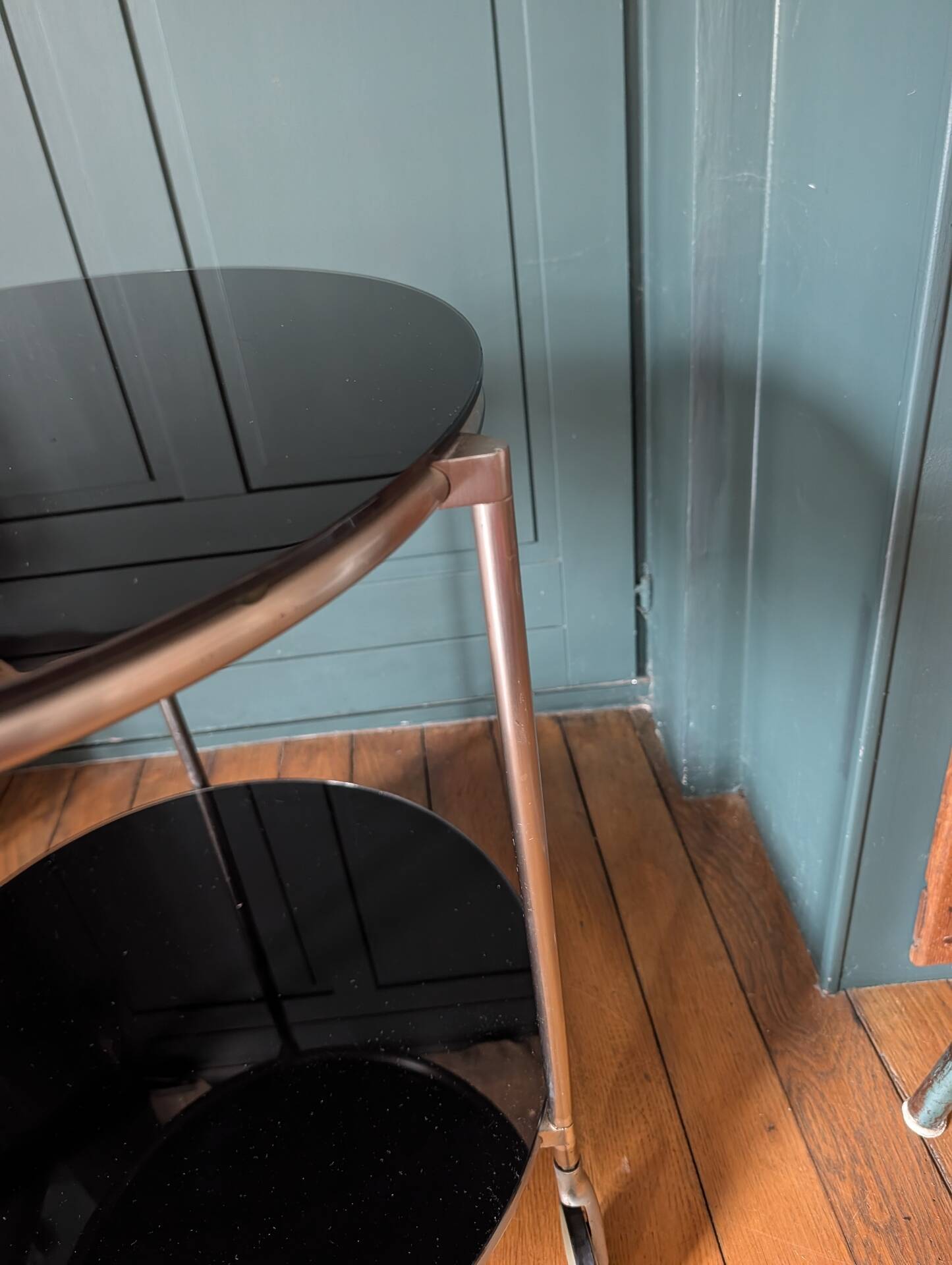 Vintage side table on wheels – black glass top