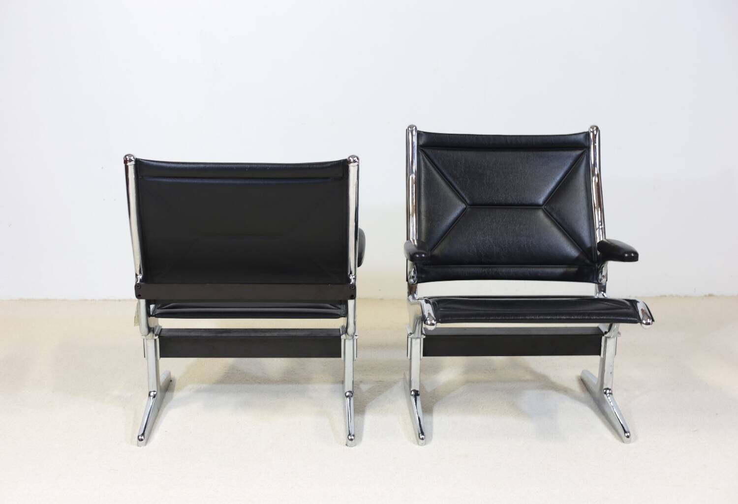 Pair of Eames Sling Tandem armchairs