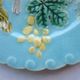 Blue barbotine plate of Sarreguemines: Birds pecking at yellow grapes