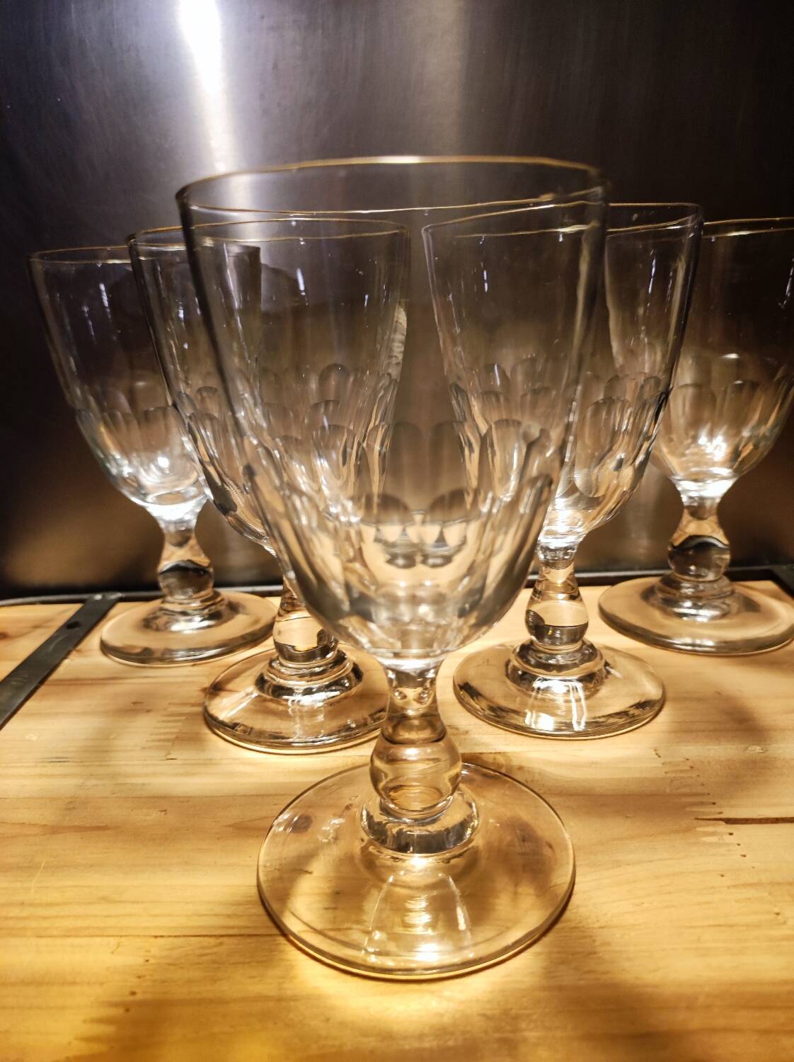 5 antique wine glasses with cut sides