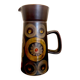 Enamelled ceramic carafe