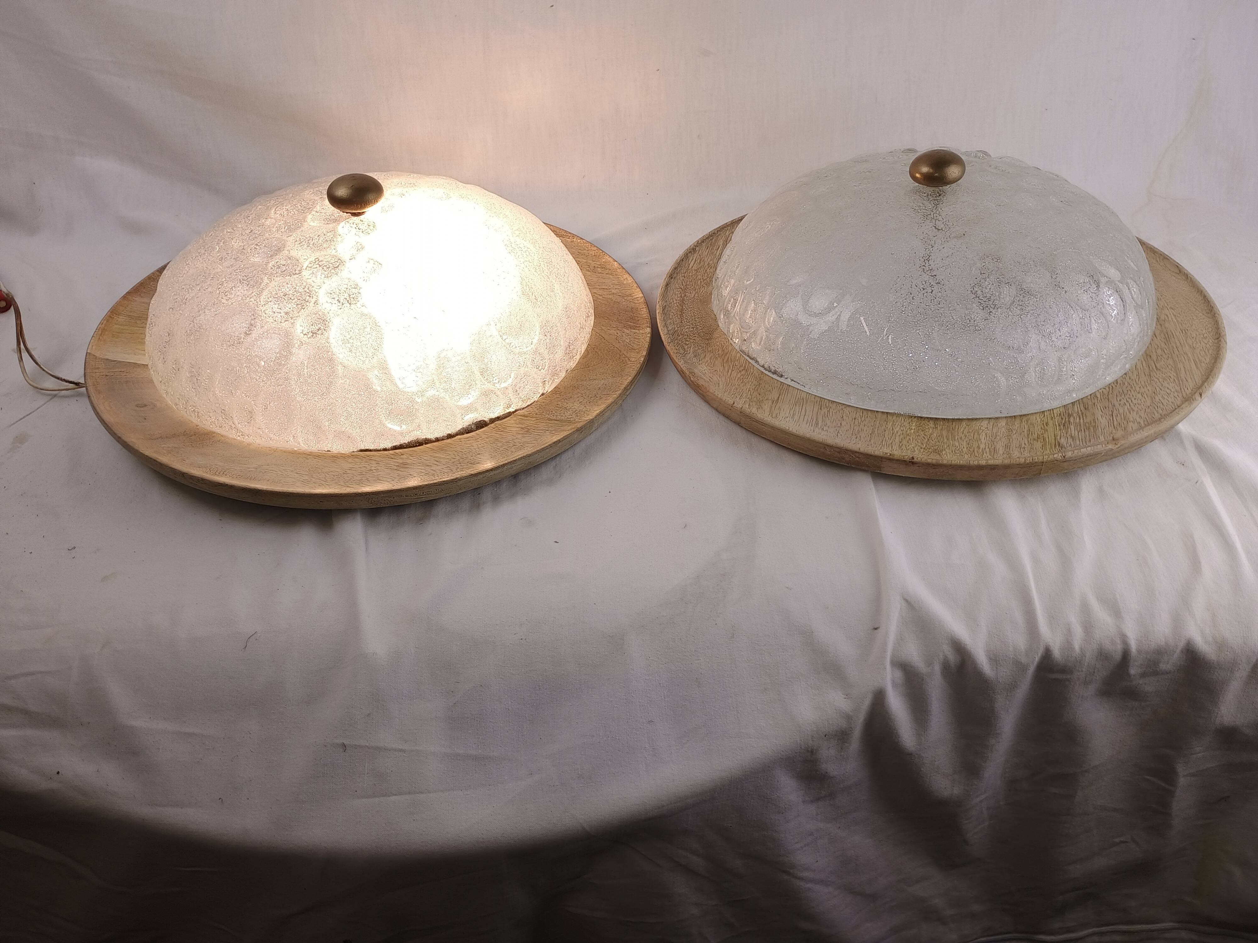 Pair of vintage Murano wall lights with exotic wood shelf.