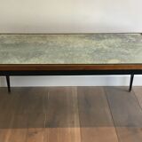 Patinated and gilded steel coffee table in the style of Jacques Quinet.