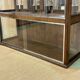 Early 20th-century shop display cabinet in oak with sliding doors.