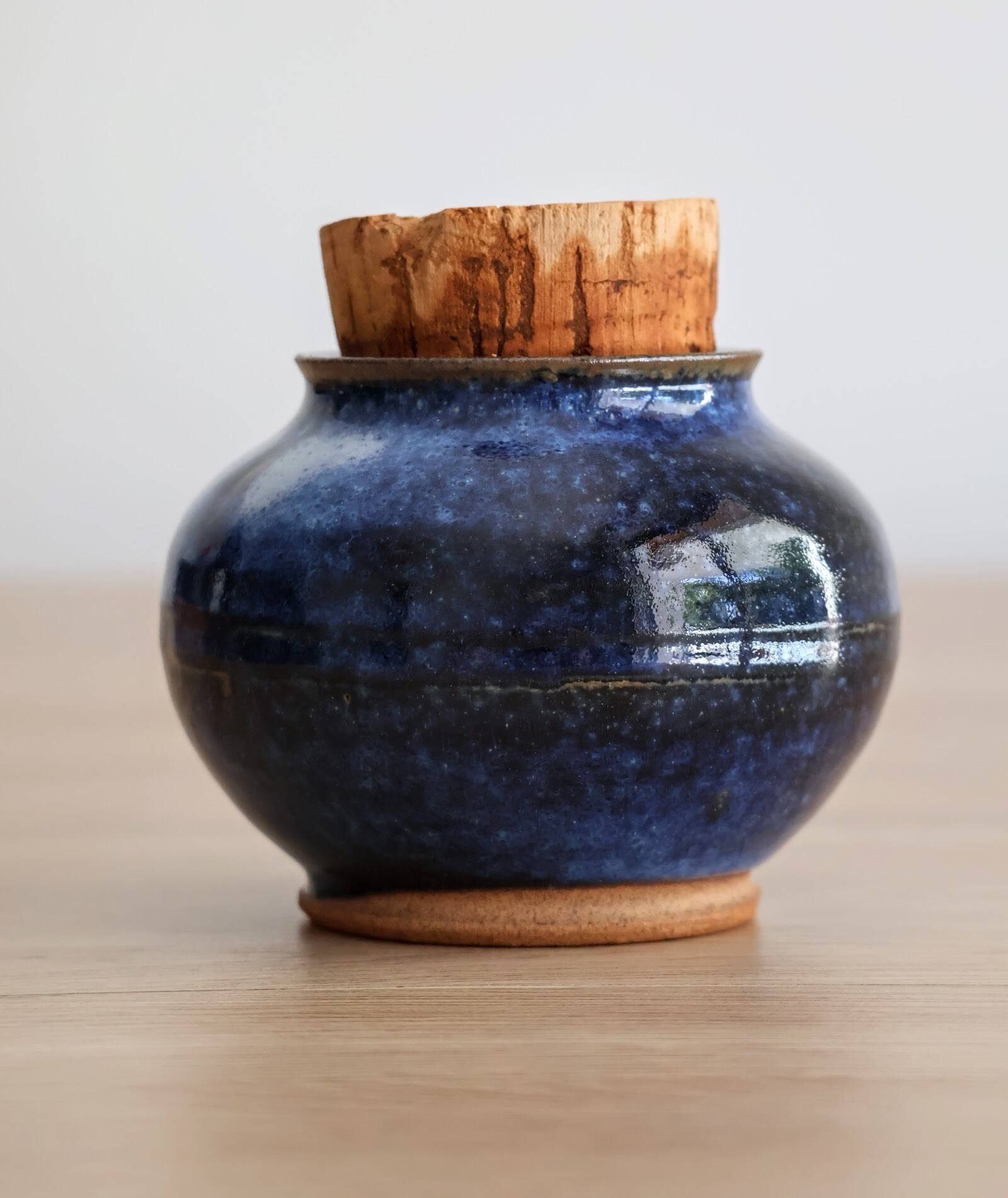 Blue glazed stoneware pot with cork stopper