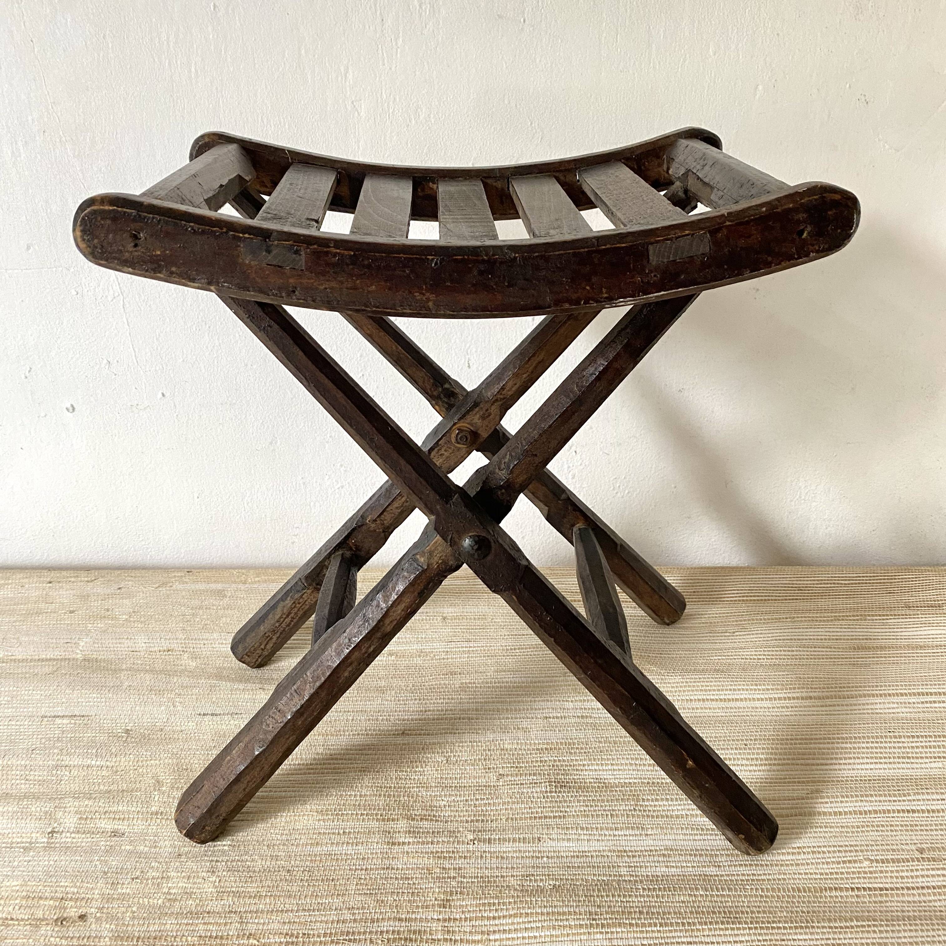 Folding slatted wooden stool