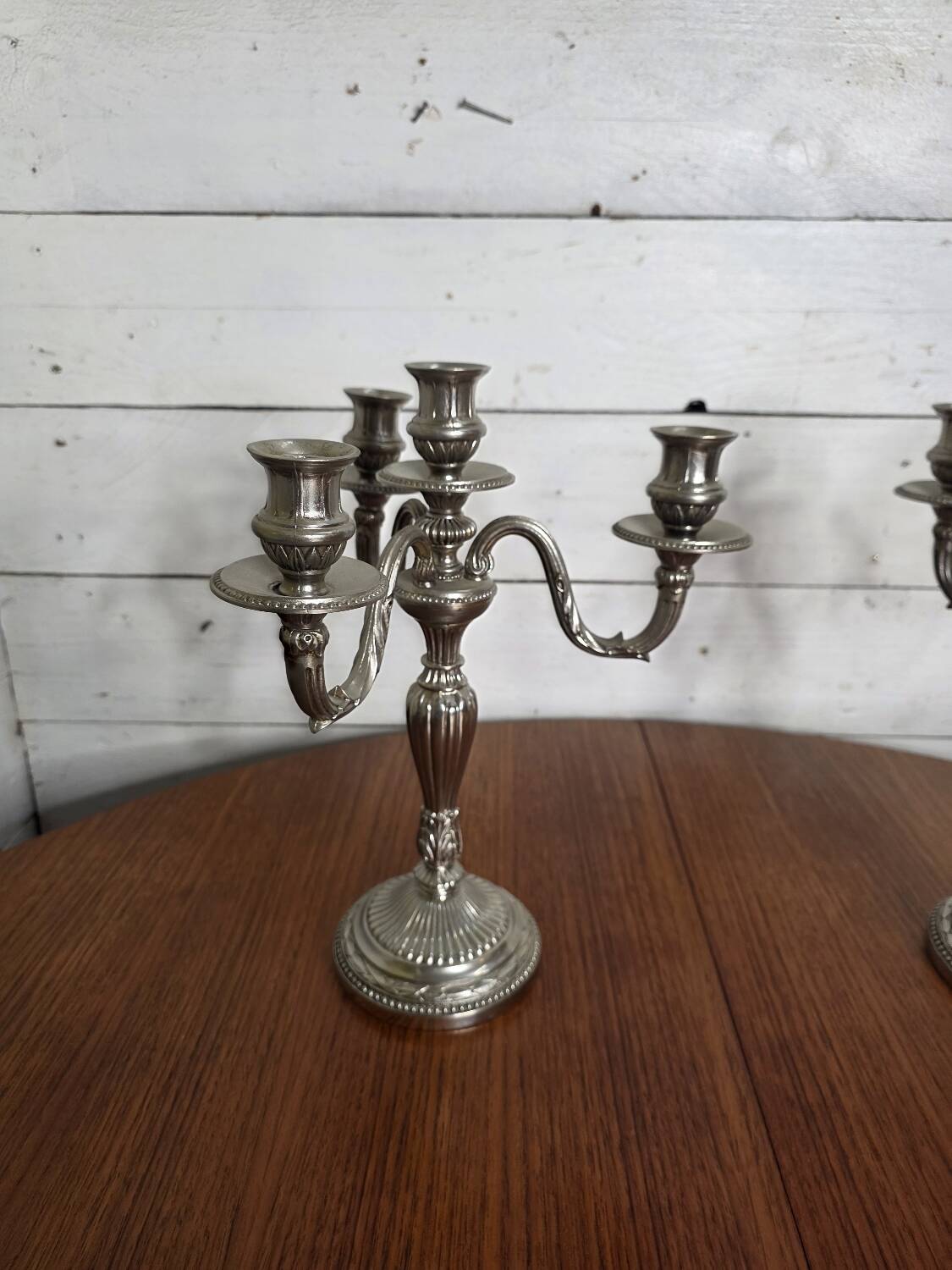 Pair of Louis XVI style candlesticks in silver-plated bronze