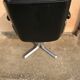 Vintage swivel black leather armchair