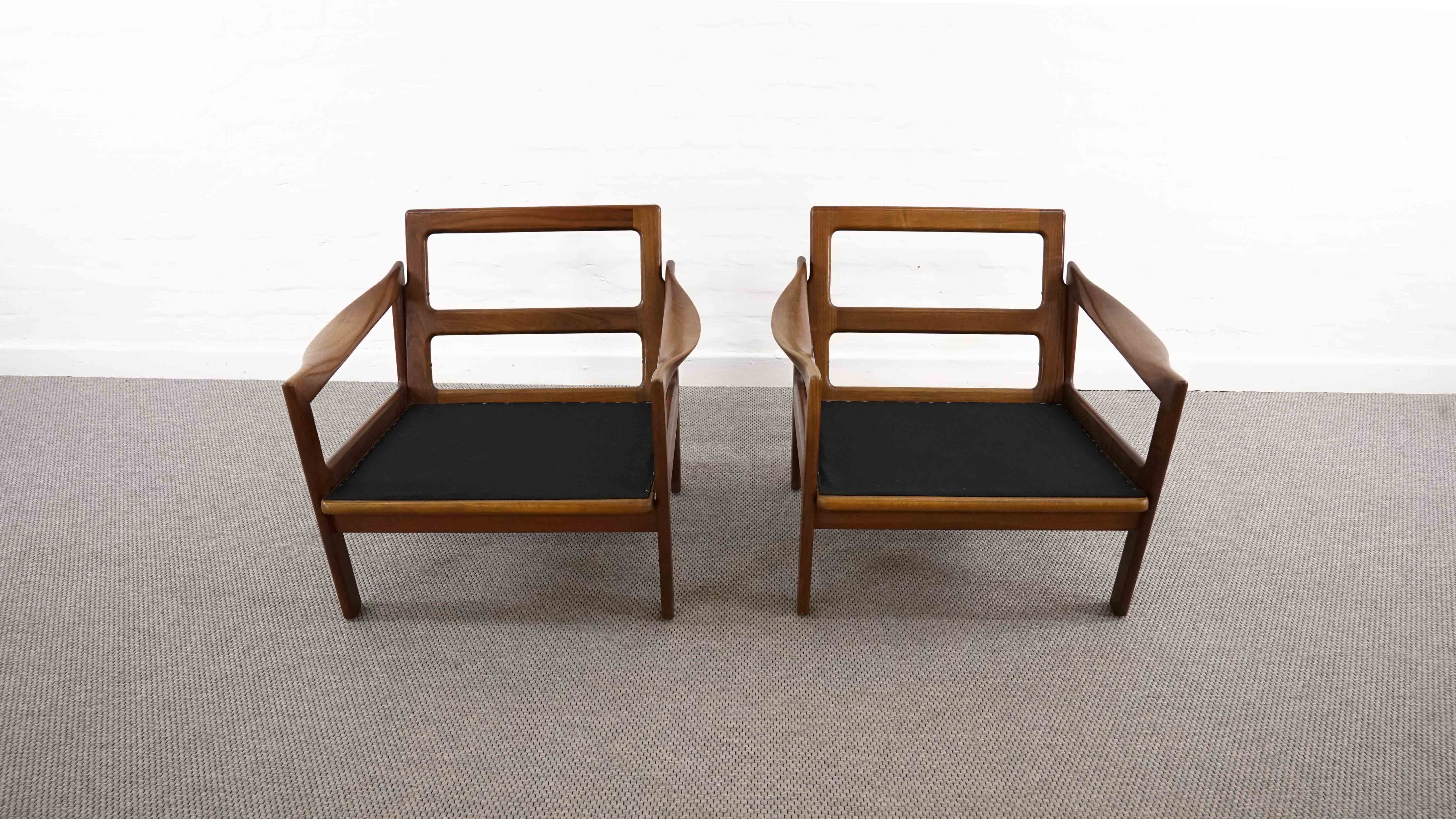 Pair of teak chairs in black leather by Illum Wikkelsoe for Niels Eilersen, Denmark