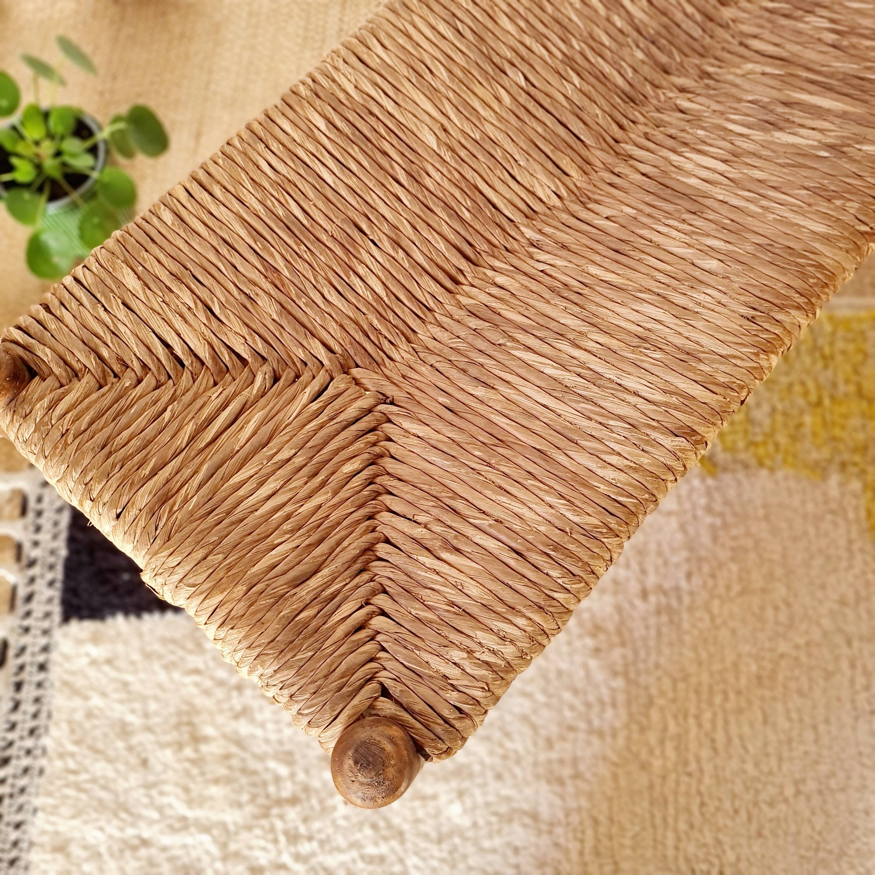 Old wooden and straw bench