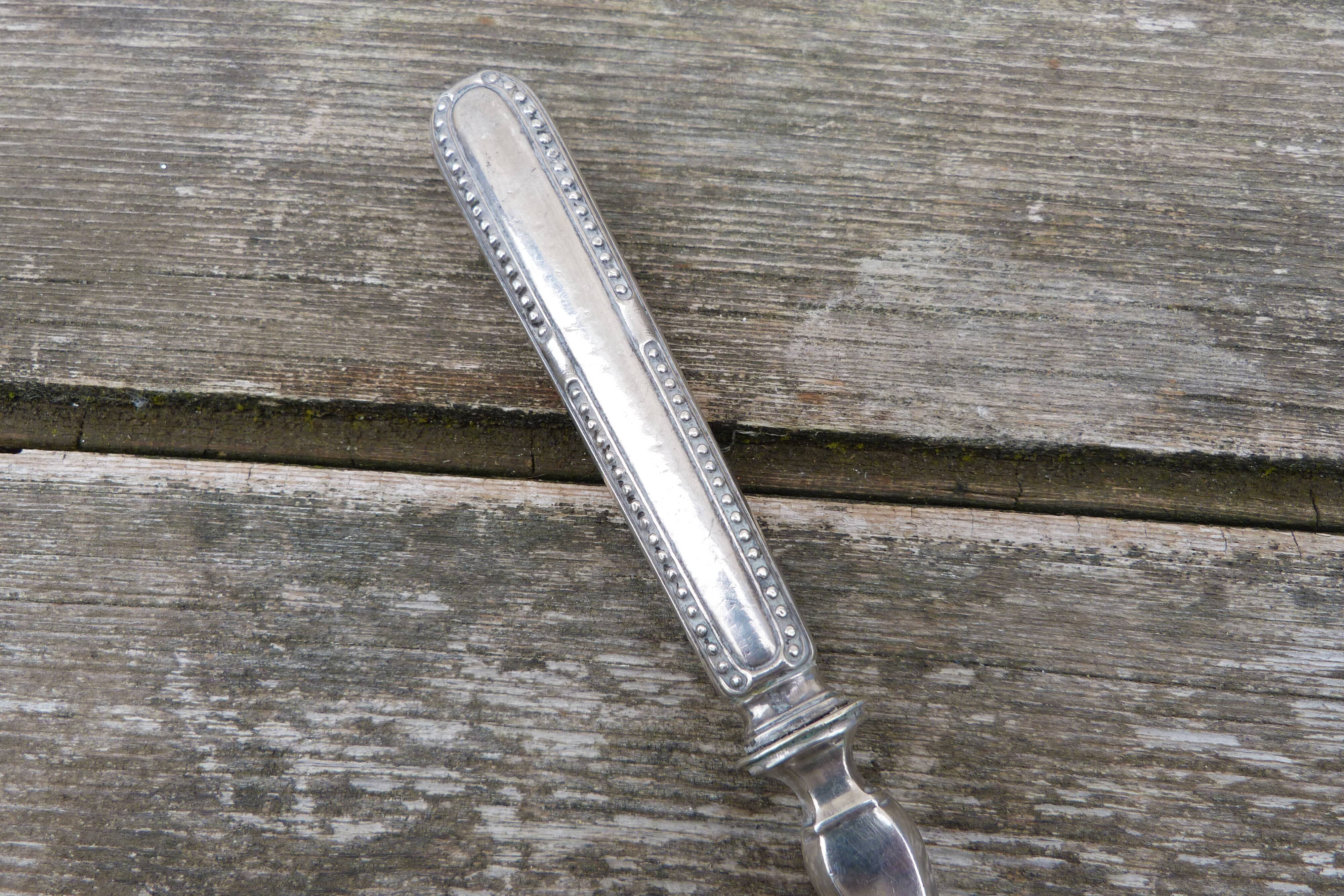 Old sauce spoon