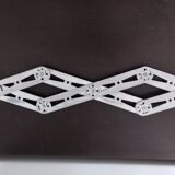 Folding extendable accordion trivet