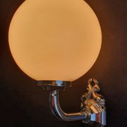 Pair of chrome wall sconces for bathroom with vintage fish pattern.