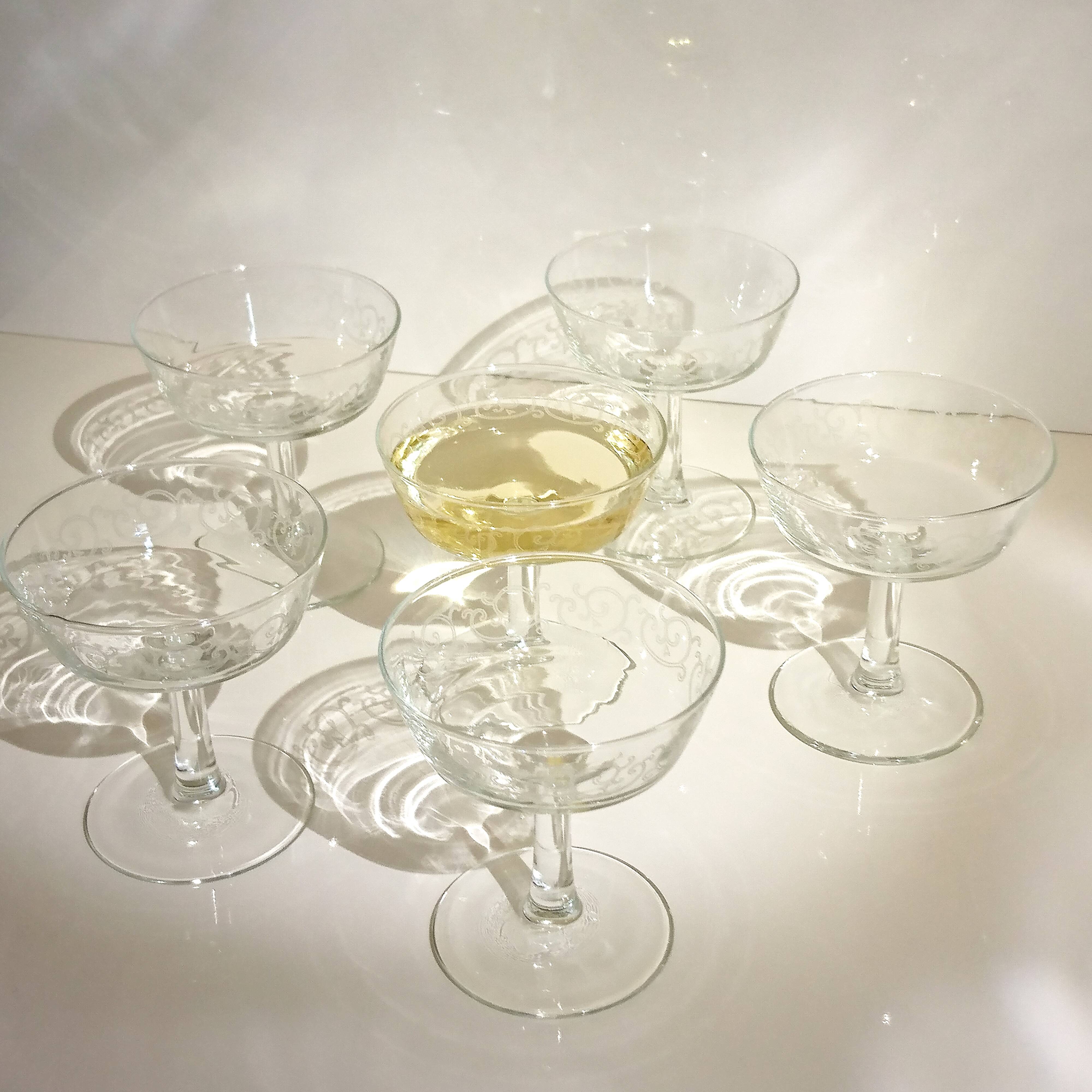 Set of 9 champagne glasses with arabesque motifs
