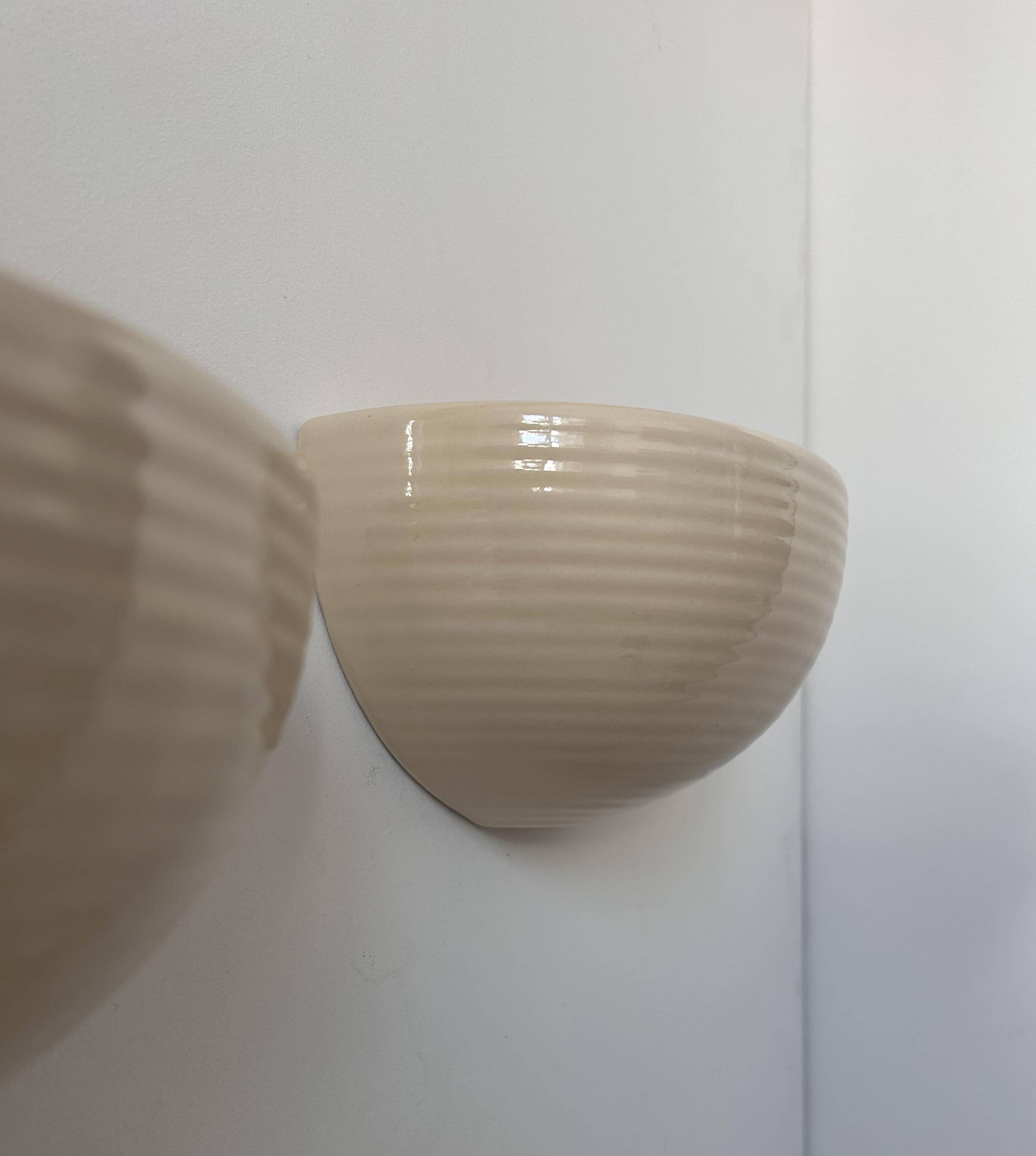 Pair of vintage wall lights, beige porcelain, France 1970