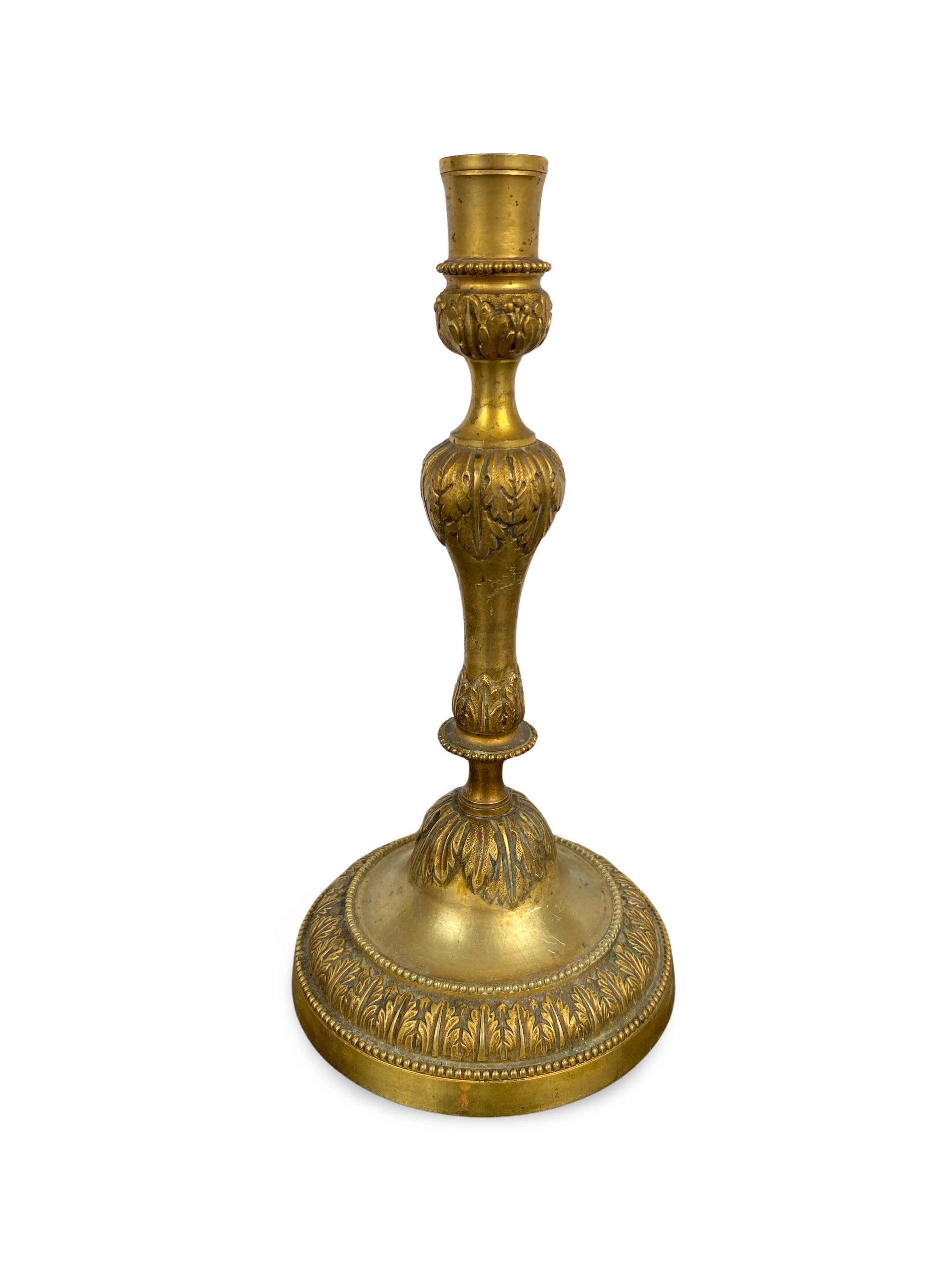 Louis XVI period candlestick in chiseled gilt bronze