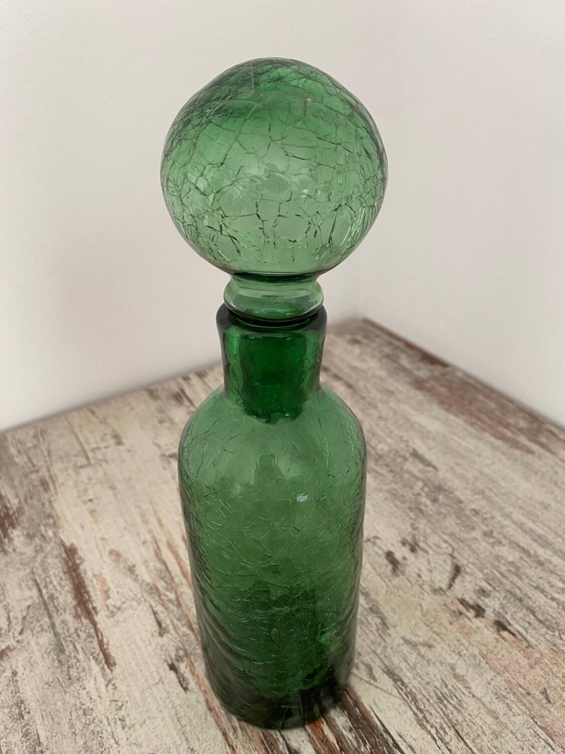 Old cracked glass carafe
