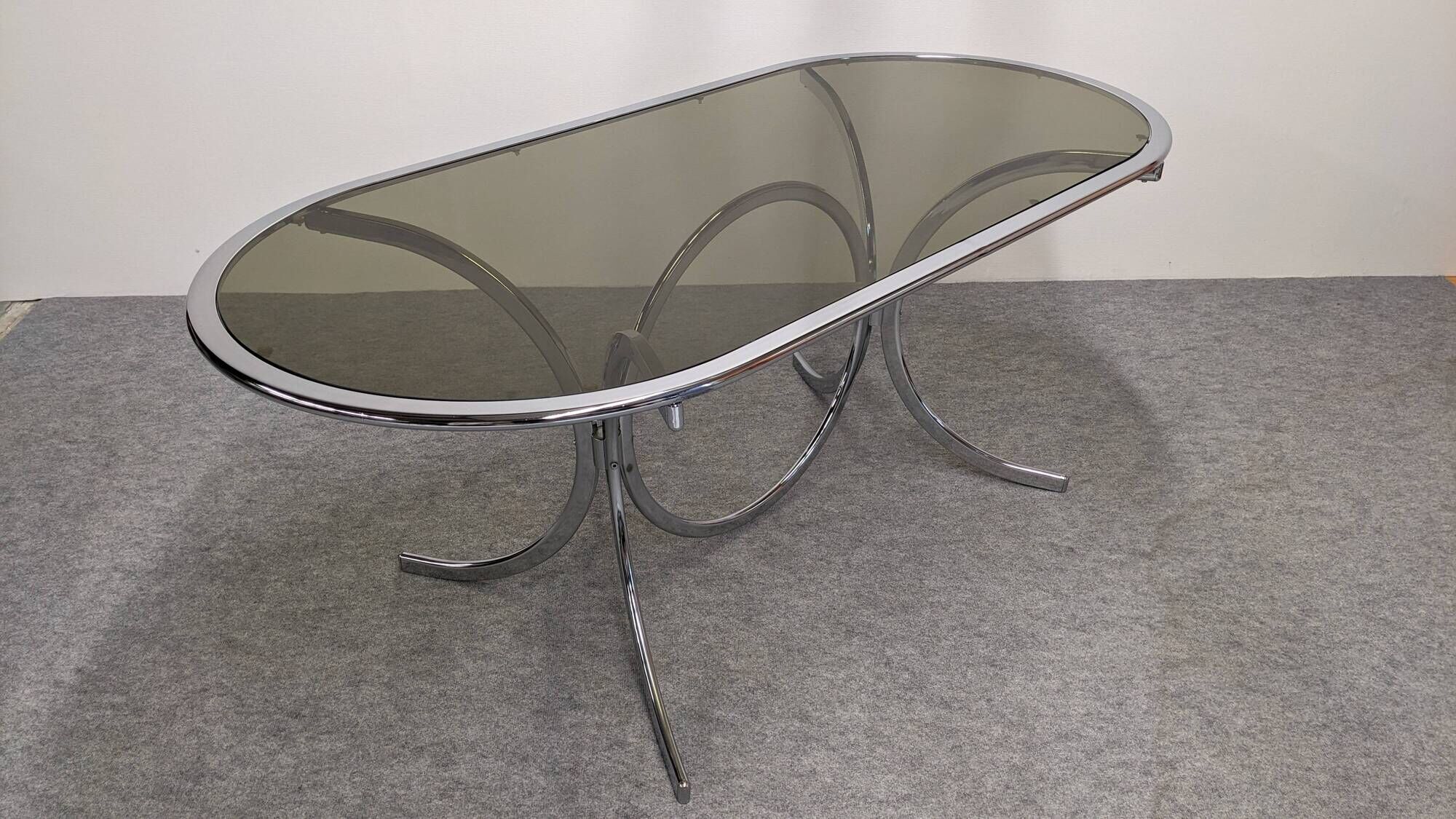 Oval dining table in chromed metal and smoked glass, Italy circa 1970