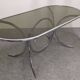 Oval dining table in chromed metal and smoked glass, Italy circa 1970