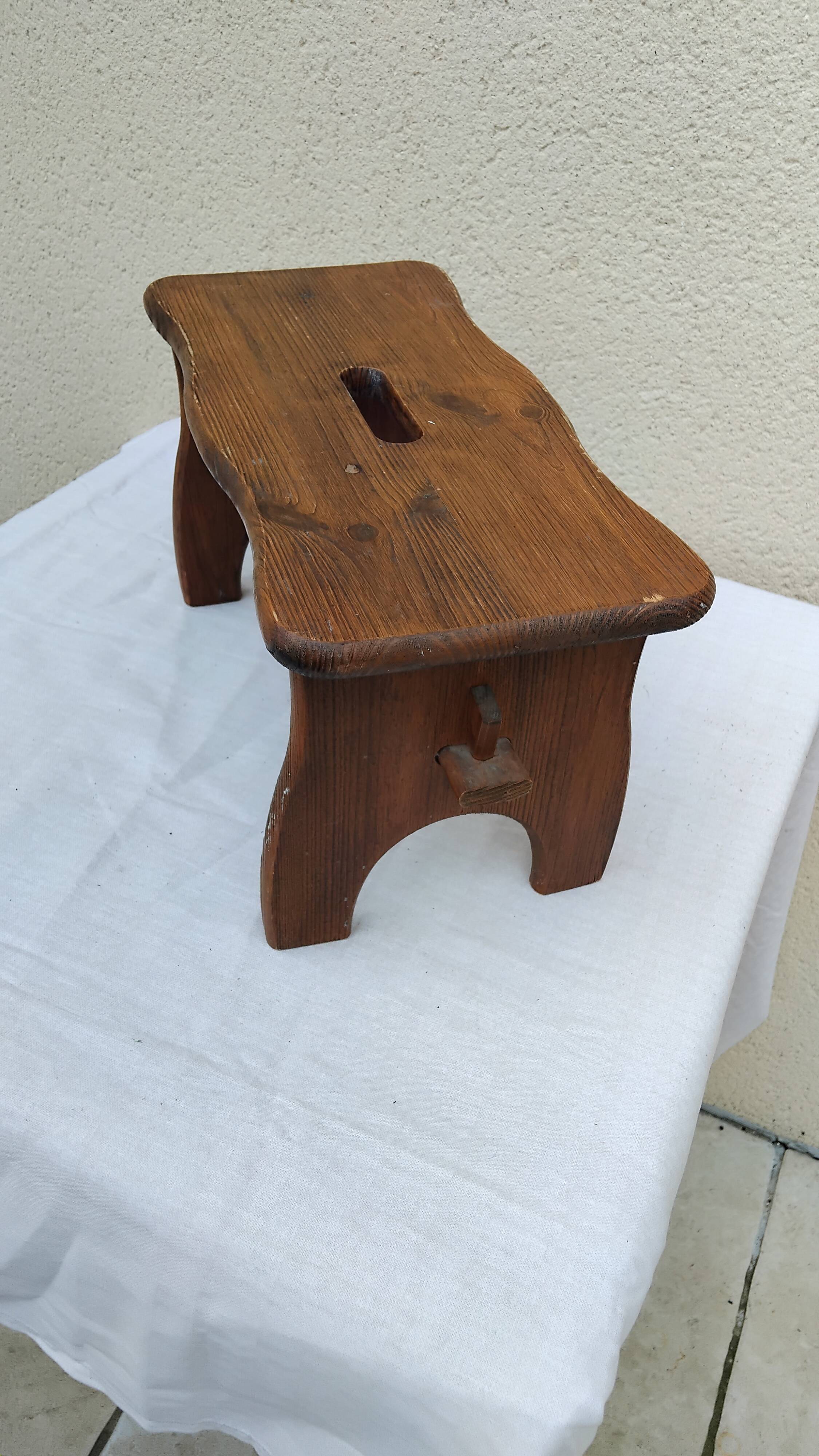 Old small vintage farm stool