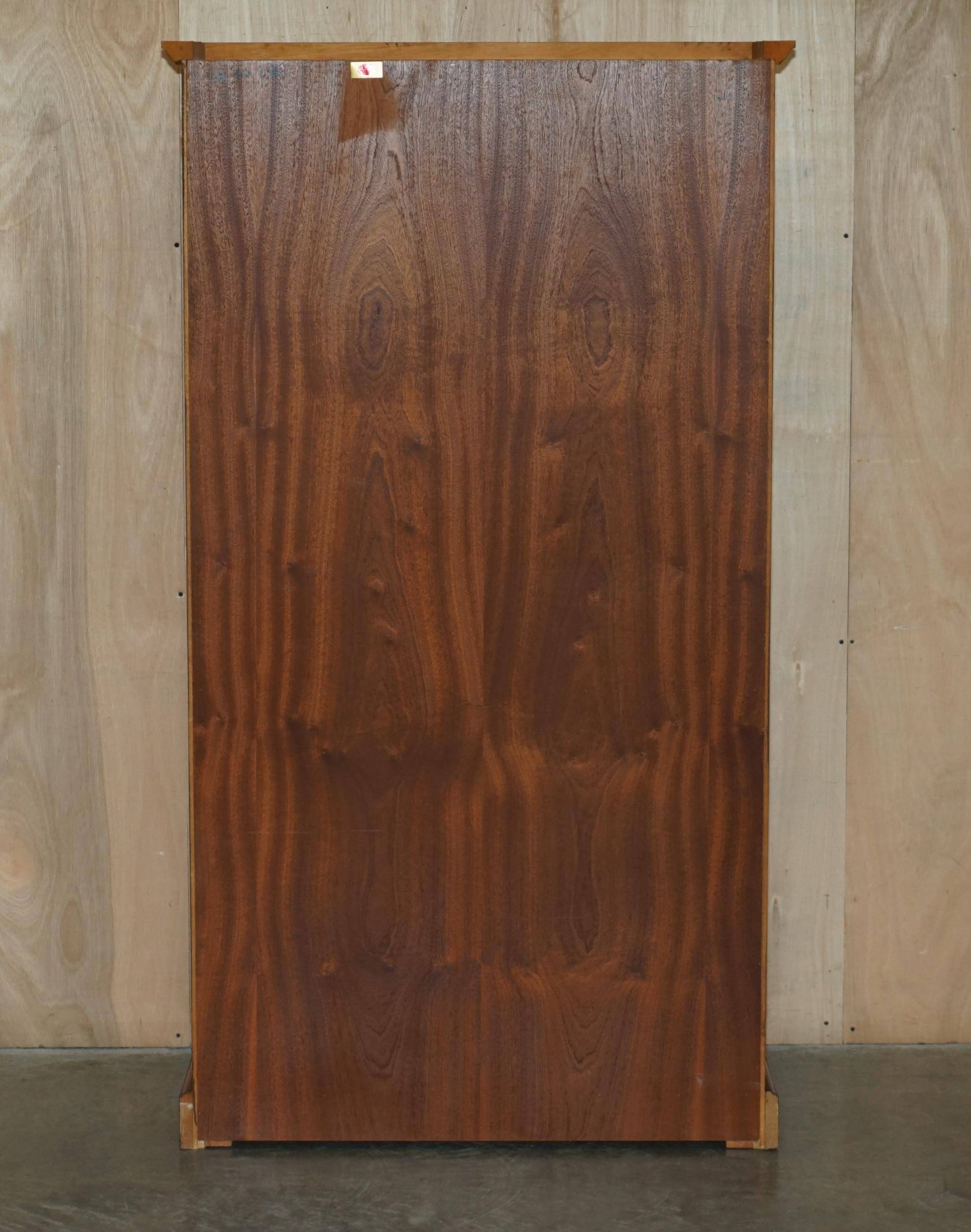 Open library Bradley Furniture made of yew wood with a cupboard base.