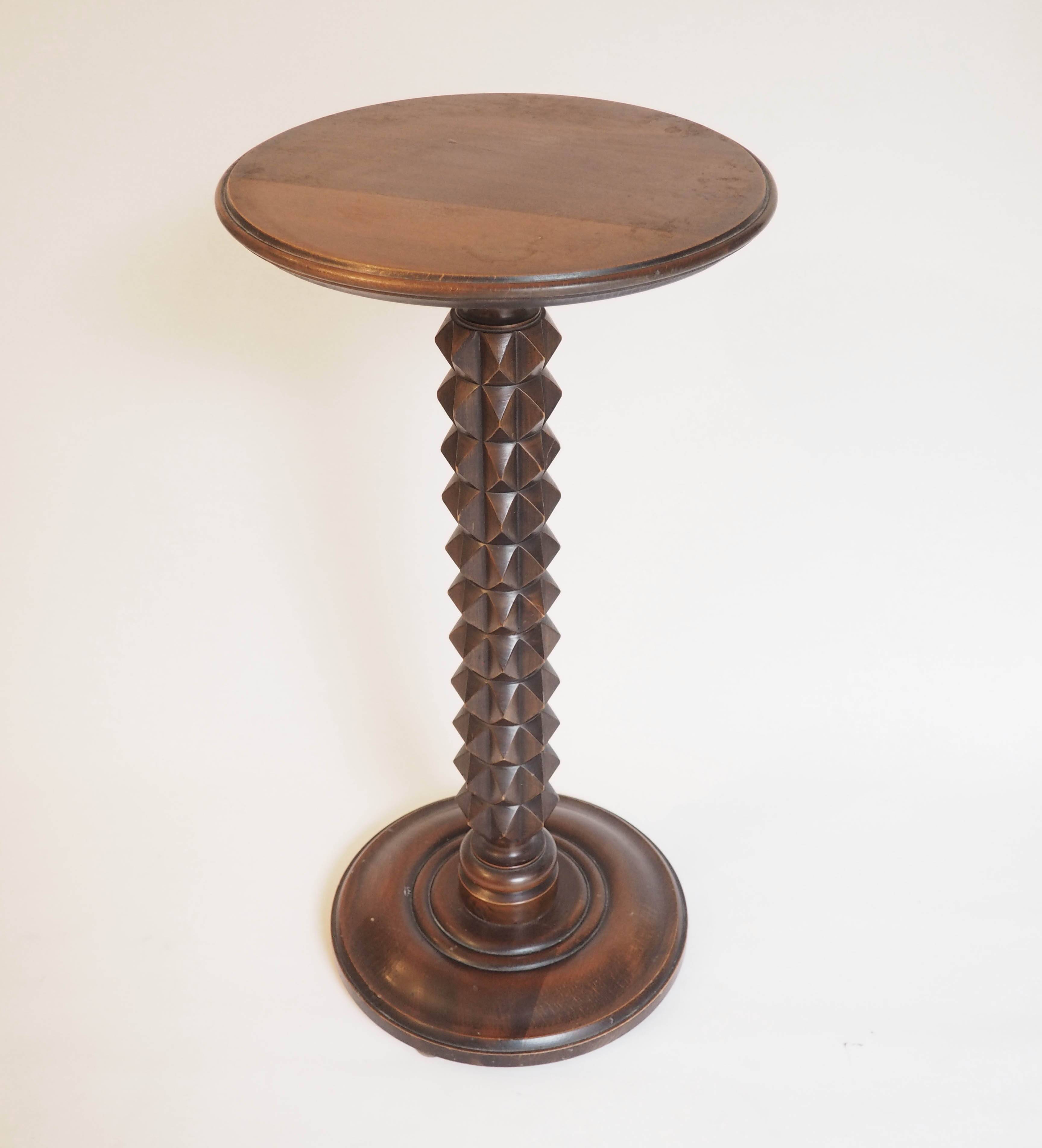 Wooden pedestal table with spiked columns