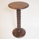 Wooden pedestal table with spiked columns