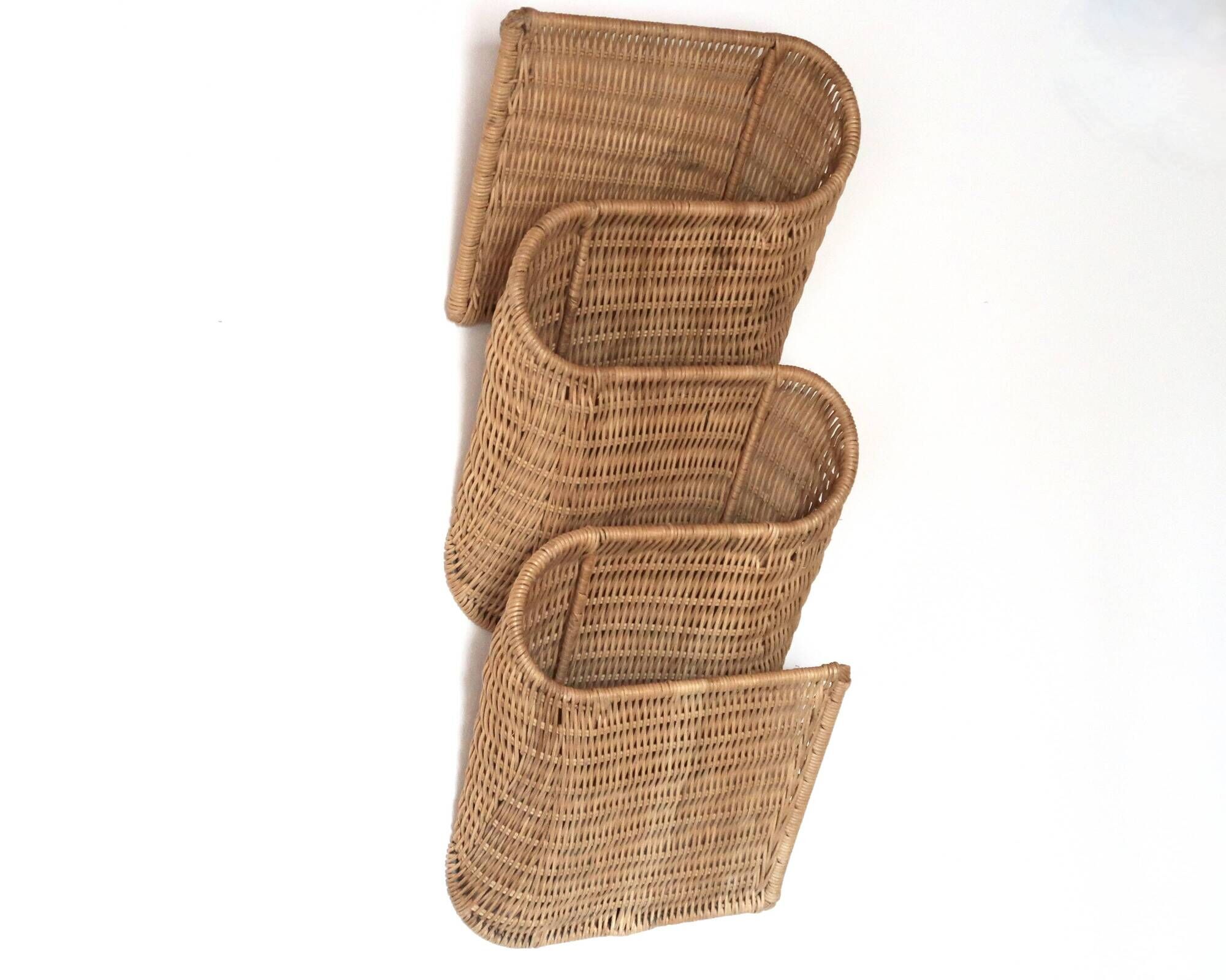 Wall-mounted magazine rack TIBY in rattan wicker by Karl Malmvall for Ikea from the 90s.