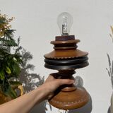 Foot of turned wooden lamp and carved