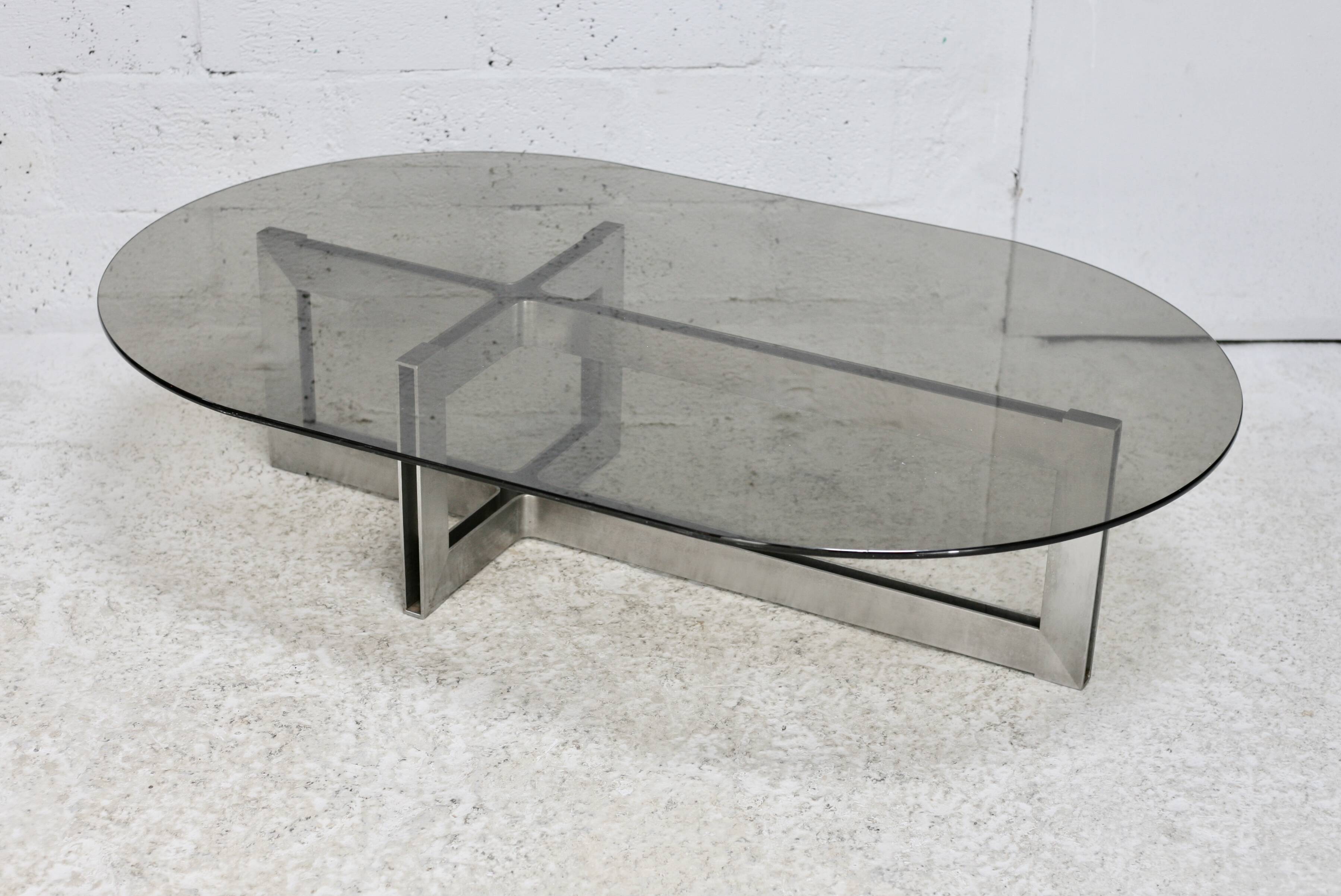 Coffee table with steel base and smoked glass slab. Circa 197