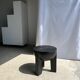Black mango wood tripod side table with a semi-spherical top, height: 45 cm, diameter: 44 cm.