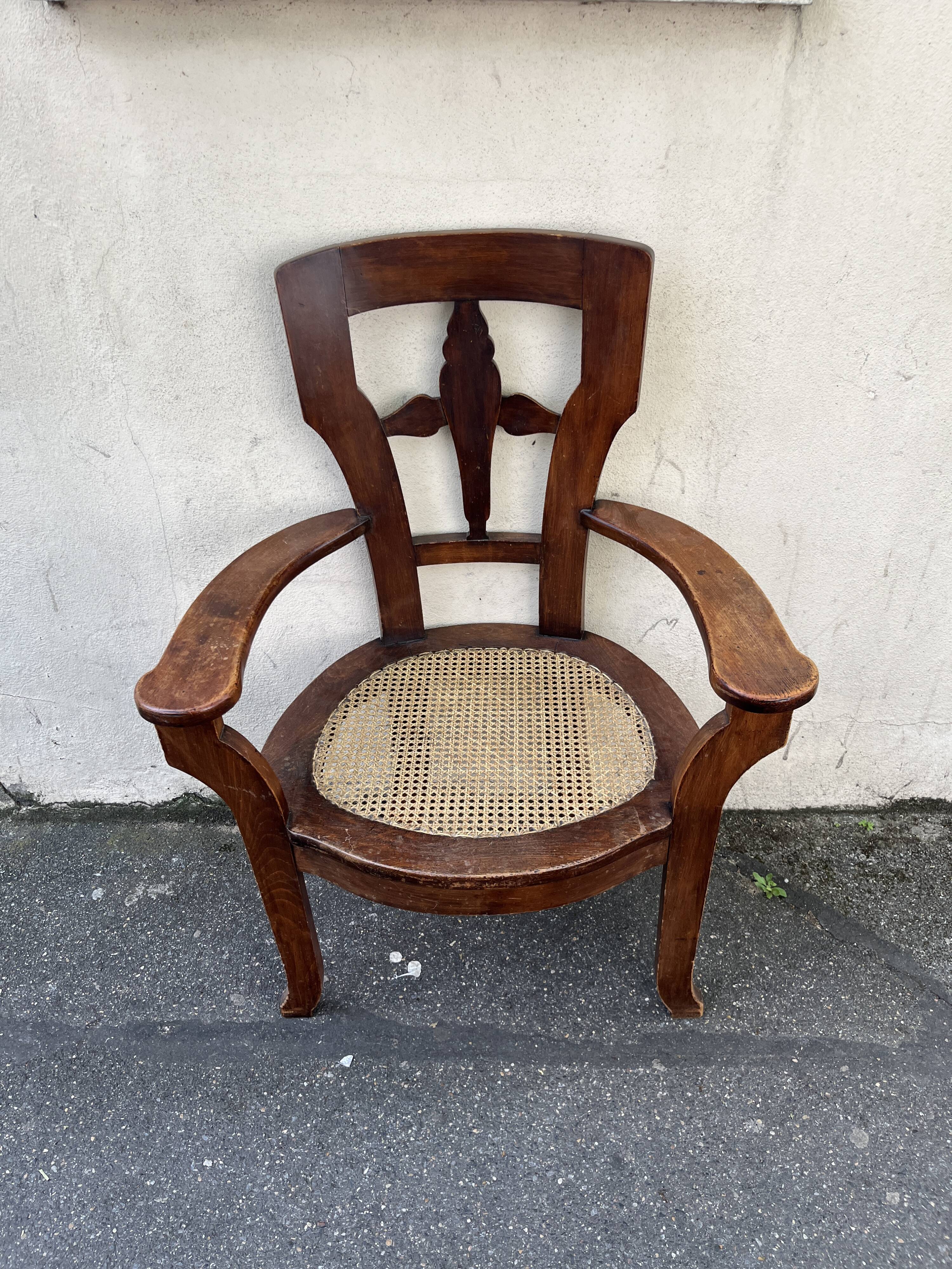 Large caned armchair