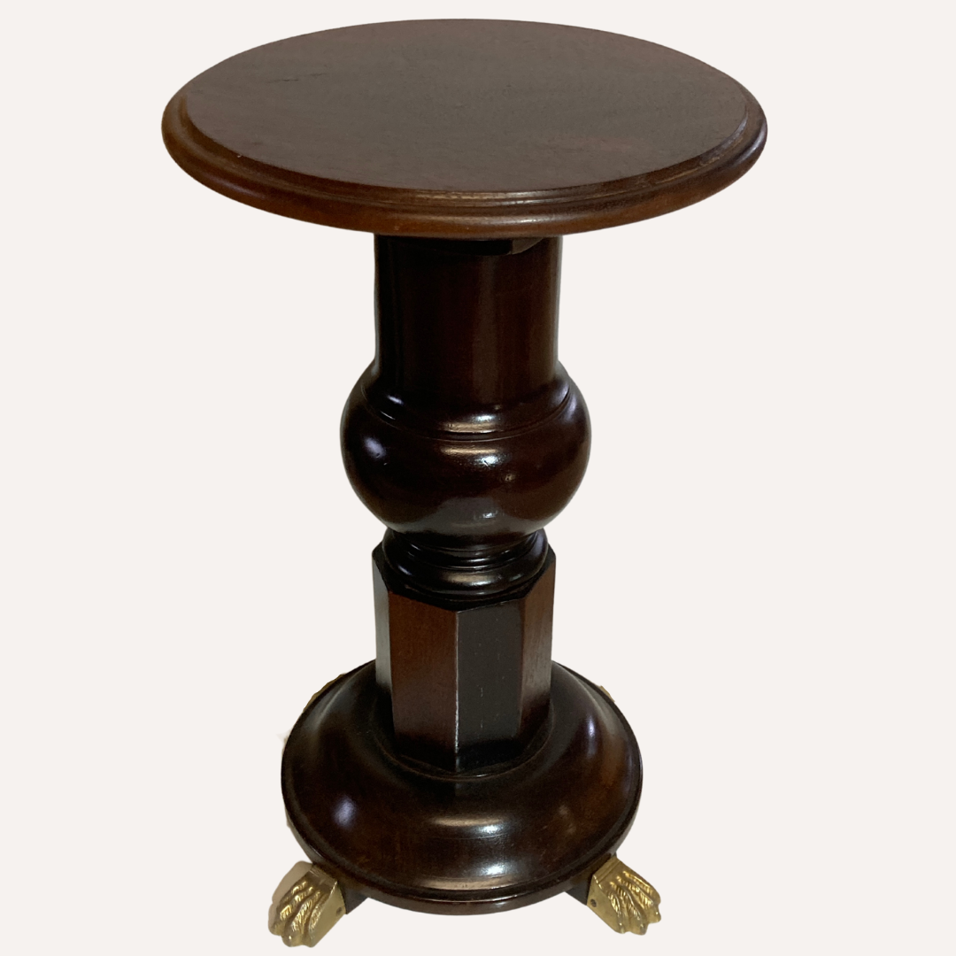 Vintage mahogany pedestal or side table with brass claw feet