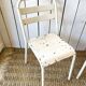 Pair of white metal bistro chairs