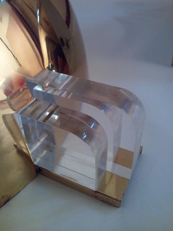 Three brass and lucite wall lights