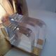Three brass and lucite wall lights