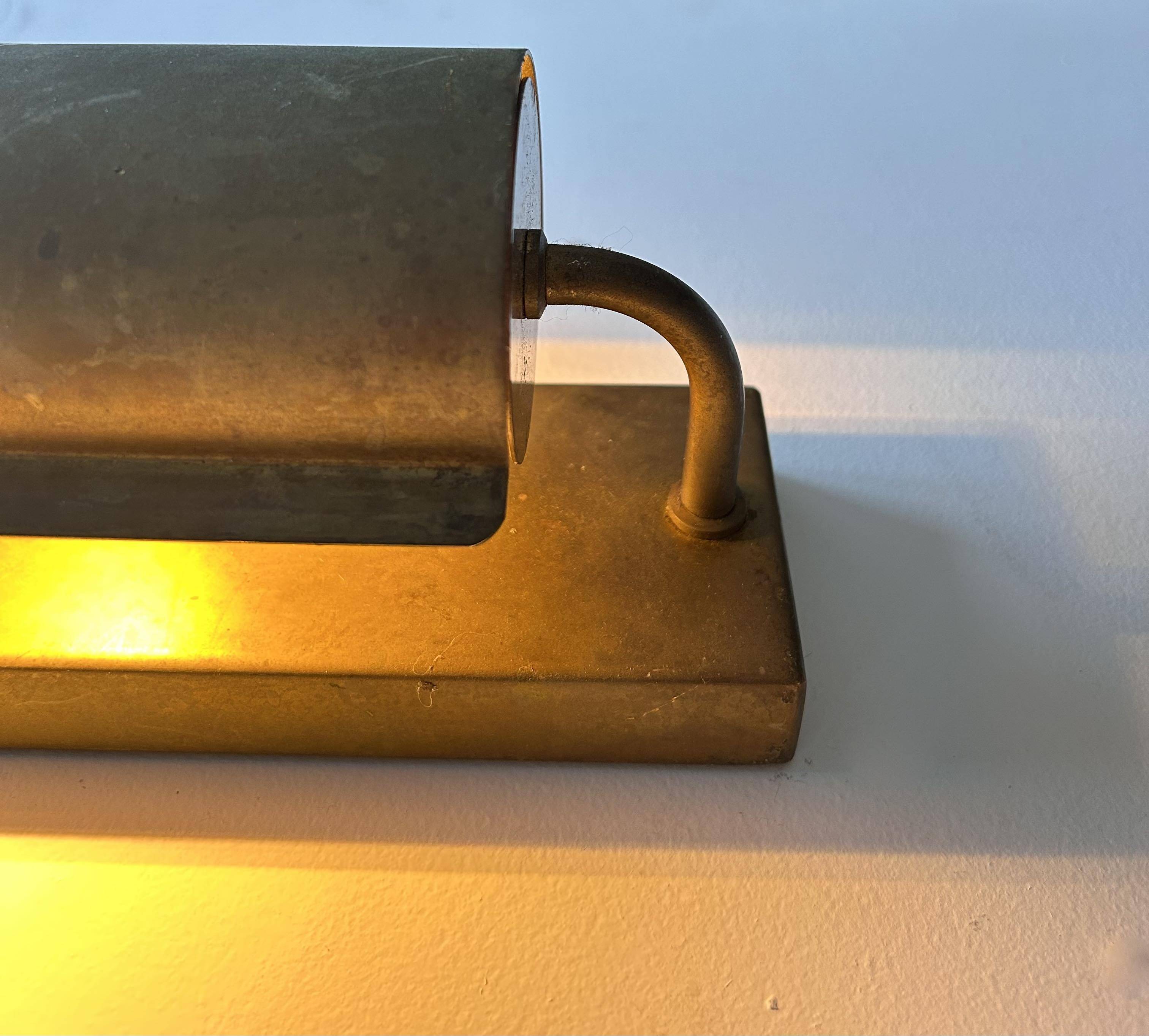 Modernist solid brass wall light, France 1940