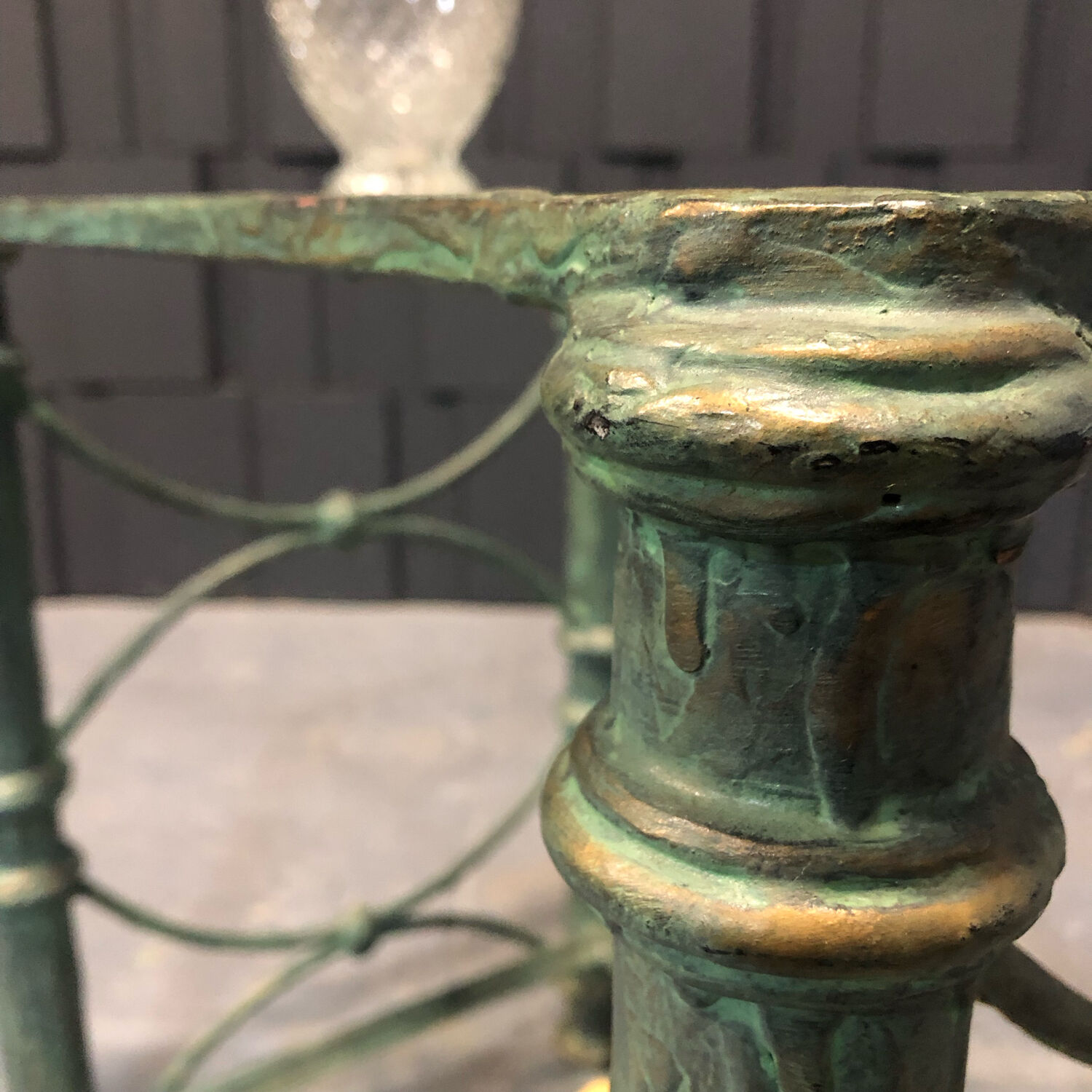 Iron and glass side table with antique patina