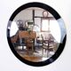Black and gold 60s round mirror
