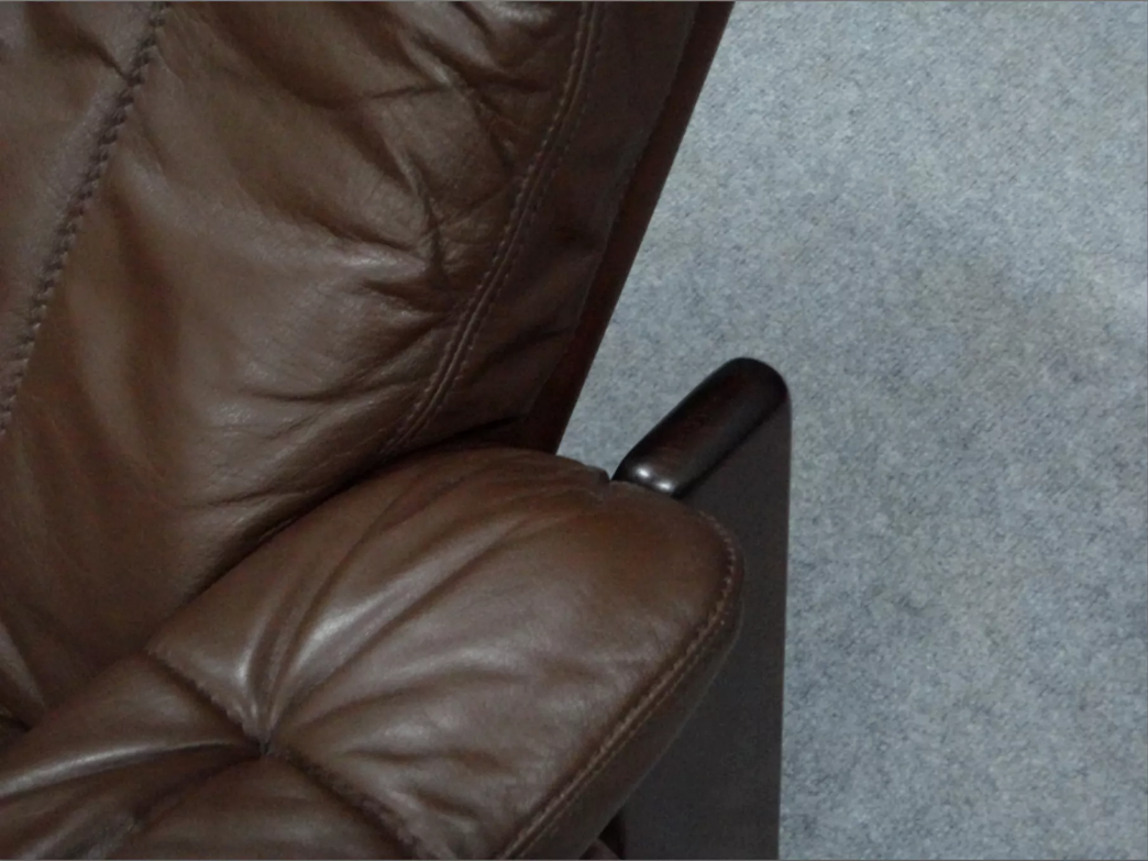 Pair of armchairs and ottoman in leather, 1970