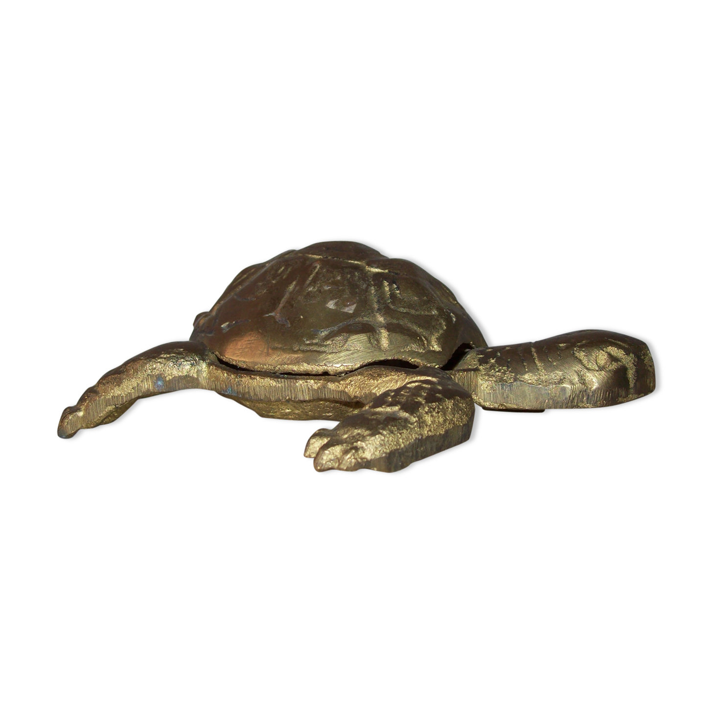 Golden brass ashtray has a turtle-shaped