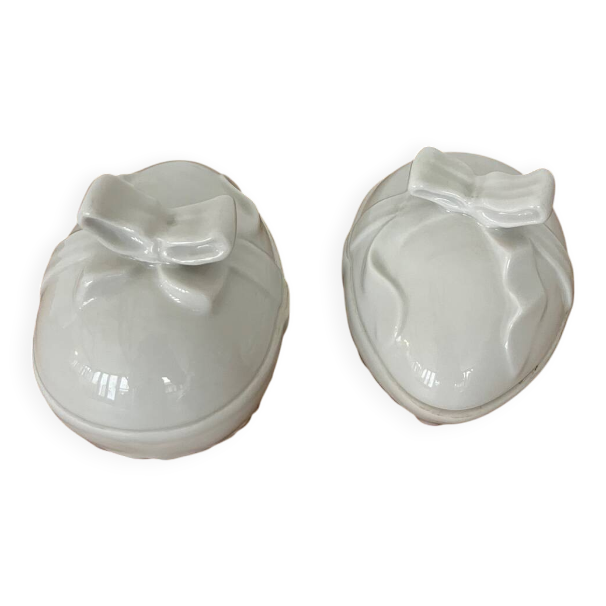 Pair of porcelain egg-shaped pocket trays