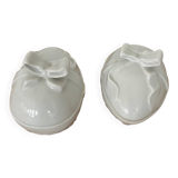 Pair of porcelain egg-shaped pocket trays