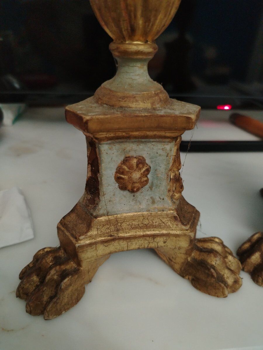 Pair of antique candlesticks in carved wood with acanthus leaf decoration