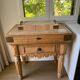 Genuine butcher's block made of solid wood with a knife drawer.